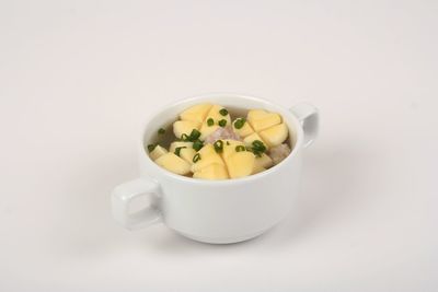 Close-up of tea cup against white background