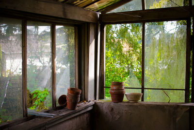 View of built structure through window