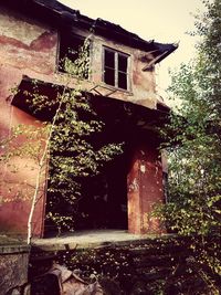 Low angle view of abandoned house