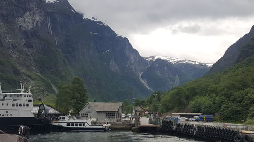 Scenic view of river with mountains in background