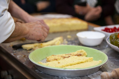 Close-up of man preparing food