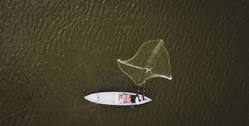 High angle view of boat floating on lake