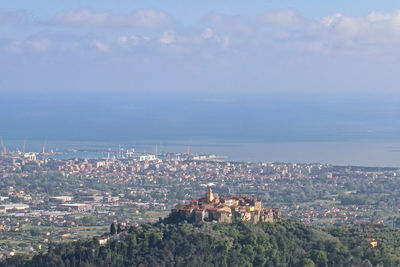 High angle view of buildings in city against sky