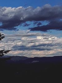 Scenic view of silhouette mountains against sky at sunset