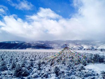 Scenic view of snow covered mountains