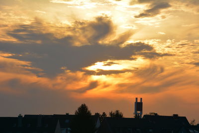 Silhouette of built structure at sunset