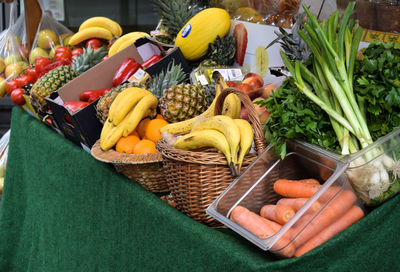 Various fruits and vegetables for sale at market stall