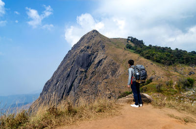 Full length of man on mountain against sky