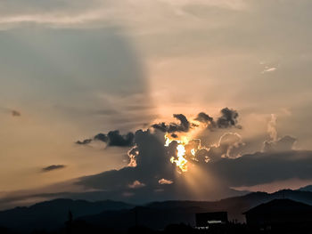 Low angle view of silhouette mountains against sky during sunset