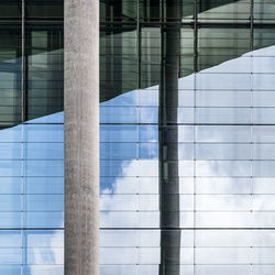 Reflection of building on glass window