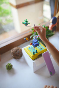 Boy playing with toy on table