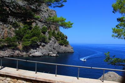 Scenic view of sea against blue sky