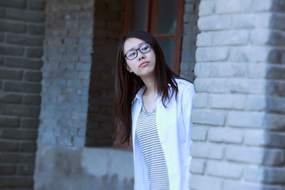 Young woman looking away in city