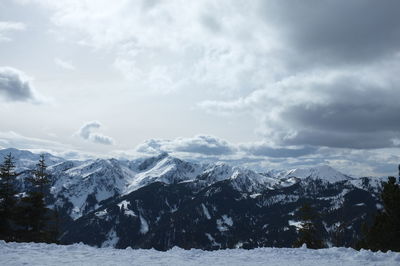 Scenic view of snowcapped mountains against sky