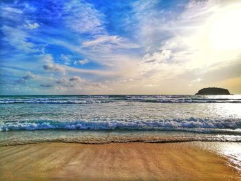 Scenic view of beach against sky during sunset