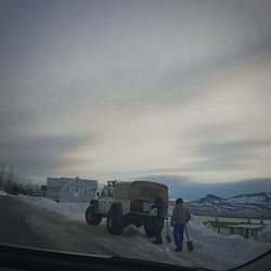 Cars on road against sky