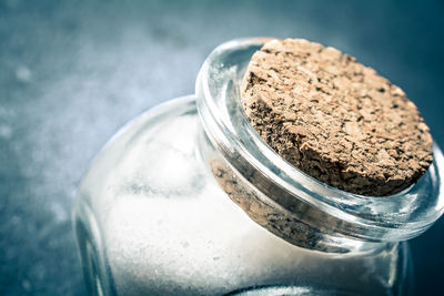 Close-up of ice cream in glass jar on table