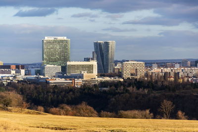 Buildings in city against sky