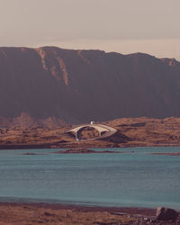 View of sea against mountain range