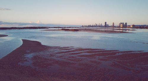 Scenic view of sea and buildings against sky