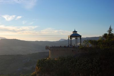 Observation point on mountain against sky during sunset