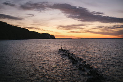 Scenic view of sea against sky during sunset