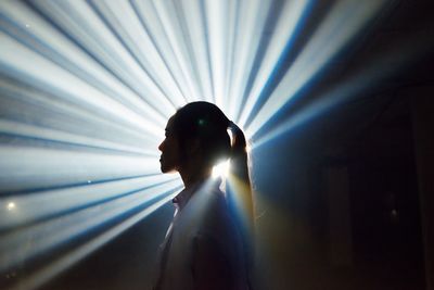 Side view portrait of silhouette man standing at night