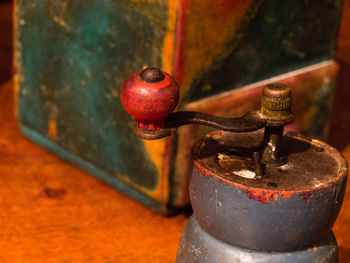 Close-up of coffee grinder on table