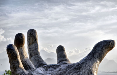 Low angle view of statue against sky