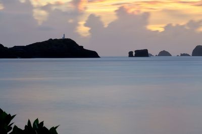 Scenic view of sea against sky at sunset