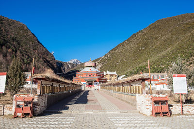 View of buildings against blue sky