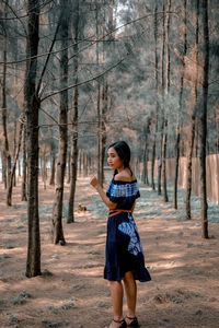 Full length of woman standing on land