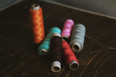 Close-up of multi colored thread spools