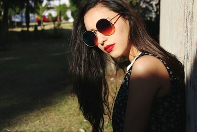 Close-up of young woman standing outdoors