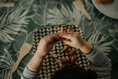 High angle view of woman holding hands