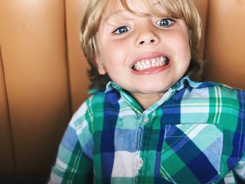 Portrait of boy with clenched teeth