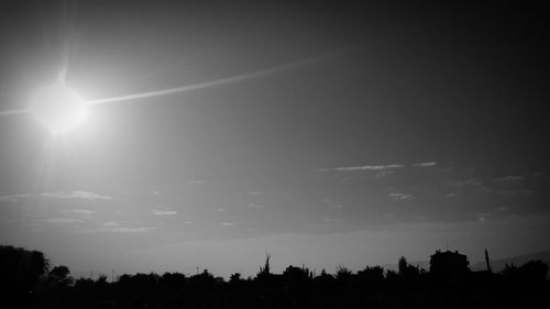 Silhouette landscape against sky