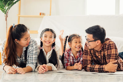 Group of people sitting at home