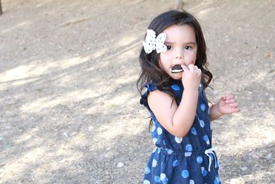 Portrait of girl eating cake