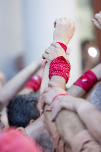 Close-up of hands with wristbands