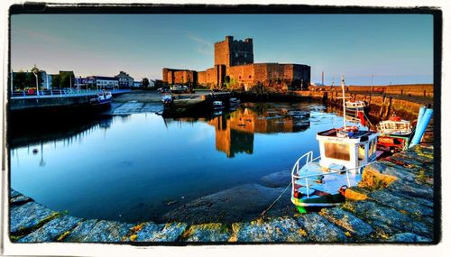 Boats moored at harbor