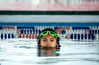 Portrait of man swimming in pool