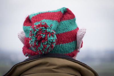 Close-up of man wearing knitted hat