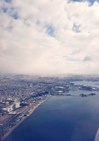 Aerial view of city against sky