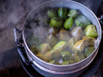 Sweets for making merit by the villagers one on the charcoal stove smells good smoke.