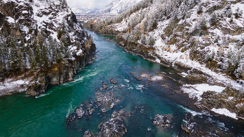 High angle view of river amidst mountains