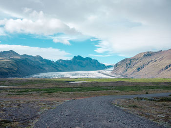 Scenic view of glacier against sky