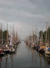 Boats moored at harbor