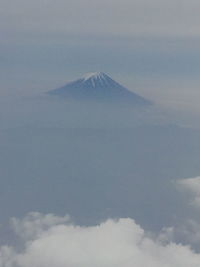 View of volcanic landscape against sky
