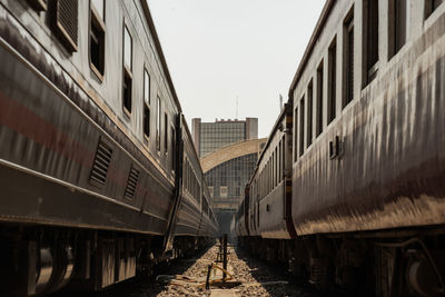 Train on railroad tracks against clear sky